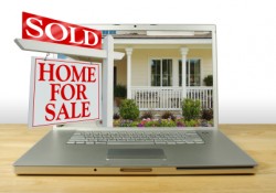 sold home over laptop graphic
