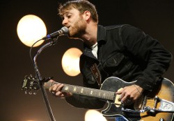guy singing with guitar