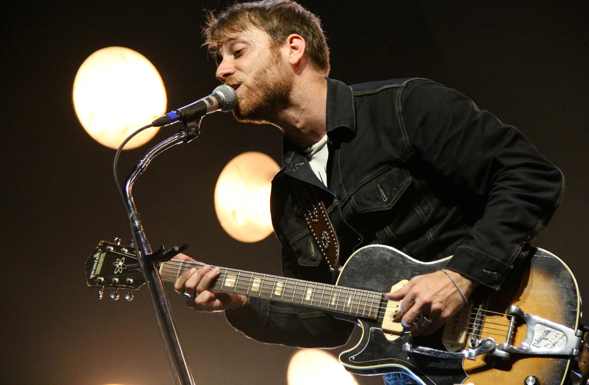 guy singing with guitar