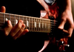 playing electric guitar