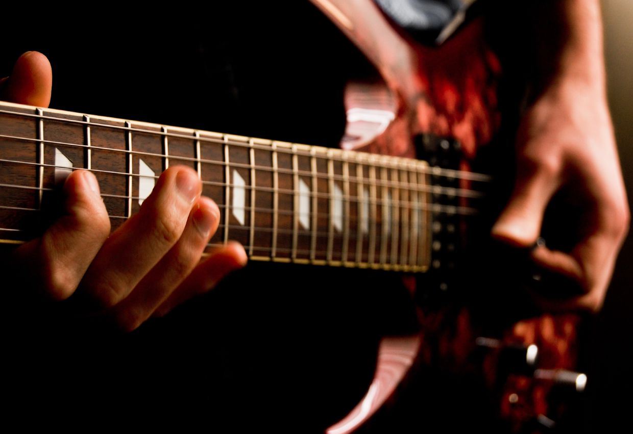 playing electric guitar